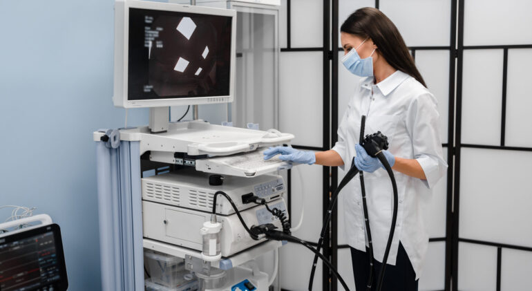 Gastroscopy endoscopy colonoscopy concept. The female doctor is ready for surgery by the Apparatus for cavity research: fibro gastroduodenoscopy, a study of the stomach.